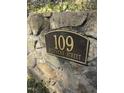 Close-up of the elegant address plaque reading '109 Stephens Street' mounted on a stone wall at 109 Stephens St, Chapel Hill, NC 27516