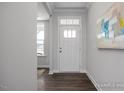 Bright foyer featuring hardwood floors, recessed lighting, and neutral paint at 1412 Main St, Lillington, NC 27546