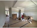 Spacious living room featuring wainscoting wall accents, ready for customization at 162 Tuskeegee Dr, Smithfield, NC 27577
