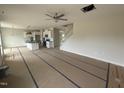 Open-concept living room with an island kitchen and staircase at 162 Tuskeegee Dr, Smithfield, NC 27577