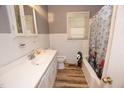 A compact bathroom with a white vanity, matching toilet, and a shower/tub combination at 1620 Old Wilson Rd, Rocky Mount, NC 27801