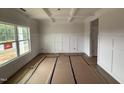 A spacious dining room featuring detailed wall trim and a large window at 188 Tuskeegee Dr, Smithfield, NC 27577
