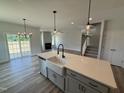 Stylish kitchen island features a farmhouse sink, pendant lights, and open views at 188 Tuskeegee Dr, Smithfield, NC 27577