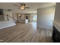 Open-concept living room with hardwood floors, fireplace, and views into the kitchen at 188 Tuskeegee Dr, Smithfield, NC 27577