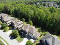 Aerial view of a beautiful home nestled in a lush, green neighborhood at 1927 Napoli Dr, Apex, NC 27502