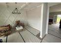 A spacious dining room with decorative wall trim and a modern chandelier at 202 Tuskeegee Dr, Smithfield, NC 27577