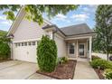 Charming home featuring a two-car garage, and beautifully landscaped front yard at 219 Rosedale Creek Dr, Durham, NC 27703