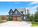 Charming two-story home featuring a two-car garage, covered entry, and well-manicured lawn at 2212 Plowridge Rd, Fuquay Varina, NC 27526