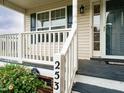 Welcoming porch with white railing and visible house number at 253 Middle Landing Dr, Smithfield, NC 27577