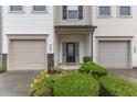 Close-up of townhome entrance with manicured bushes and inviting front door at 303 Leighann Ridge Ln, Rolesville, NC 27571