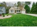 Charming home with beige siding, bay window, covered porch, and an attached one car garage at 318 Tillamook Dr, Wake Forest, NC 27587