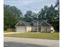 Charming brick home with a well-manicured lawn and attached two-car garage at 4001 Newby Rd, Rocky Mount, NC 27804