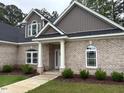 Charming brick home features manicured lawn, and arched windows at 4001 Newby Rd, Rocky Mount, NC 27804