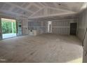 Spacious living room with sliding glass doors offering view of lush green landscape at 4248 Jacks Creek Trl, Burlington, NC 27215