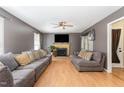 Spacious living room features hardwood floors, a fireplace, and two comfortable sofas at 628 Kankakee Ct, Knightdale, NC 27545