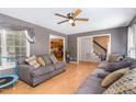 Inviting living room showcasing hardwood floors, a ceiling fan, and a view into the kitchen at 628 Kankakee Ct, Knightdale, NC 27545