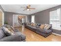 Comfortable living room with a large sofa and a view into the staircase at 628 Kankakee Ct, Knightdale, NC 27545