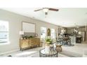 Bright living room provides lots of natural light, a dining area, and an open view of the kitchen at 75 E American Marigold Dr # 37, Benson, NC 27504