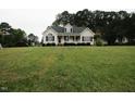 Inviting single-Gathering home with a manicured lawn, charming front porch, and classic curb appeal at 780 Pondview Ct, Rocky Mount, NC 27804