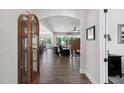 Elegant foyer with hardwood floors and an arched doorway leading to the living areas at 901 Del Webb Manor Ave, Wake Forest, NC 27587