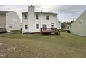 Spacious backyard with a wooden deck, great for outdoor entertaining and relaxation at 10 Gwendolyn Cir, Durham, NC 27703