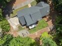 Aerial view of the home's backyard featuring a patio, fire pit area and well-maintained landscaping at 10817 Brass Kettle Rd, Raleigh, NC 27614