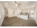 Bright, open-concept living space connects to the modern kitchen with stainless steel appliances at 112 Ambergate Ct, Rocky Mount, NC 27804