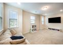 Bright bonus room with neutral carpet, great natural light, and built-in shelving at 1201 Pleasant Falls Ct, Wake Forest, NC 27587