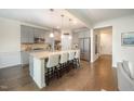Modern kitchen with granite countertops, stainless steel appliances, and a central island with bar seating at 1201 Pleasant Falls Ct, Wake Forest, NC 27587