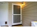 Close-up of the white screen door entrance featuring natural lighting at 121 Westview Dr # 22, Carrboro, NC 27510