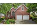 Beautiful brick home featuring an attached two-car garage and well-maintained landscaping at 1224 Wedgeland Dr, Raleigh, NC 27615