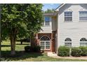 Well-maintained exterior of home featuring manicured lawn and tidy shrubs at 2111 Piney Brook Rd # 101, Raleigh, NC 27614