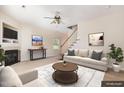 Living room showcasing a fireplace, staircase, neutral color palette, and stylish furnishings at 2111 Piney Brook Rd # 101, Raleigh, NC 27614