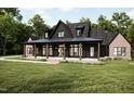 Beautiful two-story home with a covered front porch and well-manicured lawn at 300 Westerman Pl, Smithfield, NC 27577