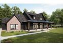 Charming home with a covered porch, featuring a combination of brick and dark siding at 300 Westerman Pl, Smithfield, NC 27577