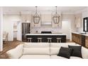 Open-concept living space featuring a modern kitchen and comfortable seating area at 300 Westerman Pl, Smithfield, NC 27577