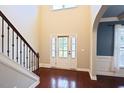 Bright foyer boasts hardwood floors, soaring ceilings, and abundant natural light from the front door at 337 Shadowdale Ln, Rolesville, NC 27571