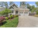 Attractive home with a two-car garage, a manicured lawn and an inviting walkway at 3914 Old Chapel Hill Rd, Durham, NC 27707