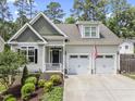 Beautiful two-story home featuring a well-maintained lawn and a classic architectural design at 3914 Old Chapel Hill Rd, Durham, NC 27707