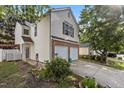 Charming two-story home featuring a two-car garage, brick accents, and well-manicured landscaping at 4216 Lake Woodard Dr, Raleigh, NC 27604