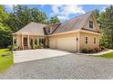 Spacious three-car garage and rear exterior of home at 4306 Infinity Ln, Durham, NC 27705