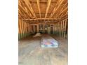 Unfinished basement with exposed beams and a concrete floor, ready for customization at 448 Golden Dragonfly St, Wake Forest, NC 27587