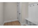Functional mud room with storage bench, hooks, and a closet for organization at 448 Golden Dragonfly St, Wake Forest, NC 27587