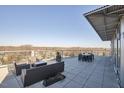 Large rooftop deck area with outdoor furniture and expansive views, perfect for entertaining and enjoying the scenery at 601 W Rosemary St # 712, Chapel Hill, NC 27516