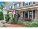 Inviting covered front porch with brick and stone details, perfect for relaxing outdoors at 62 Jubilee Ct, Clayton, NC 27527