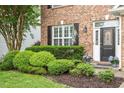 Well maintained front exterior with manicured landscaping and brick facade at 825 Federal House Ave, Wake Forest, NC 27587