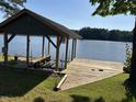 Well-maintained boat dock on the lake with a lift at 929 Sagamore Dr, Louisburg, NC 27549