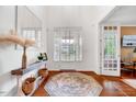 Bright foyer with gleaming hardwood floors and elegant decor creating an inviting entrance at 101 Ironcreek Pl, Apex, NC 27539
