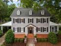 Classic exterior view, featuring a well-manicured lawn and a welcoming entrance at 1015 Watts St, Durham, NC 27701