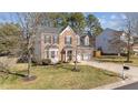 Lovely exterior view of a brick home with a two-car garage and well-maintained landscaping at 105 Stoney Dr, Durham, NC 27703